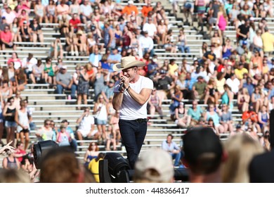 NASHVILLE-JUL 11: Country recording artist Dustin Lynch performs during the 'Kick The Dust Up' Tour at Vanderbilt Stadium on July 11, 2015 in Nashville, Tennessee. - Shutterstock ID 448366417
