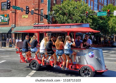 Nashville,USA - Sep 21, 2019:  Revelers Enjoy Drinks On A Sprocket Rocket Pedal Bike Tavern On Broadway Street.  The Vehicles Are Powered By The Pedaling Of The Passengers And Are Very Popular.