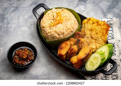 Nasi Cikur, Fried Rice Seasoned With Kencur (aromatic Ginger) Served With Fried Chicken, Tempeh And Chili. One Of The Traditional Foods From West Java, Indonesia