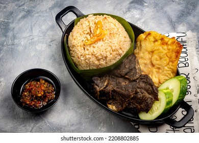 Nasi Cikur, Fried Rice Seasoned With Kencur (aromatic Ginger) Served With Lungs, Tempeh And Chili. One Of The Traditional Foods From West Java, Indonesia