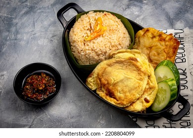 Nasi Cikur, Fried Rice Seasoned With Kencur (aromatic Ginger) Served With Omelet, Tempeh And Chili. One Of The Traditional Foods From West Java, Indonesia