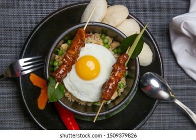 Nasi goreng - fried rice with chicken satay and a fried egg. Exquisite dish. Creative restaurant meal concept. - Shutterstock ID 1509379826