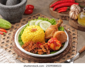 Nasi Kuning. Yellow rice is a typical Indonesian food. This food is made from rice cooked with turmeric, coconut milk and spices - Powered by Shutterstock