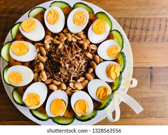 Nasi Lemak Cake With Condiments Of Hard Boiled Eggs, Peanuts, Fried Anchovies, Cucumber Slices And Chili Shrimp