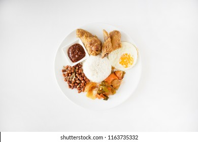 Nasi Lemak Flatlay On White Table. Singapore Food, Malaysian Food Called Nasi Lemak Or Coconut Rice, Shot Top Down. Nasi Lemak With Copy Space. 