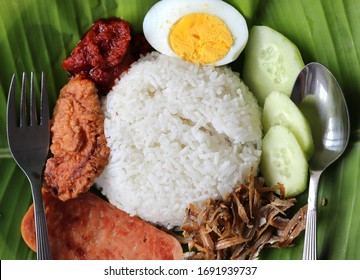 Nasi Lemak Is A Fragrant Rice Dish Cooked In Coconut Milk And Served In Banana Leaf. It Is Considered The National Dish Of Malaysia And Enjoyed By All Races Such As Malay, Chinese And Indians Etc.