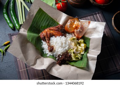 Nasi Lemak Kukus With Chicken, Popular Traditional Malay Local Food. Flat Lay Top Down Overhead View.