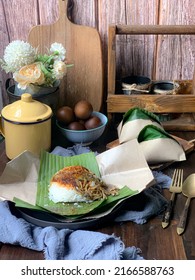 Nasi Lemak, A Malay Style Complete Meal Of Fragrant Rice Cooked In Coconut Milk, Wrapped In Banana Leave.