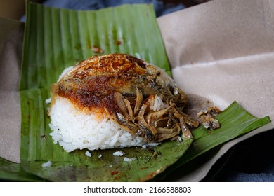 Nasi Lemak, A Malay Style Complete Meal Of Fragrant Rice Cooked In Coconut Milk, Wrapped In Banana Leave.
