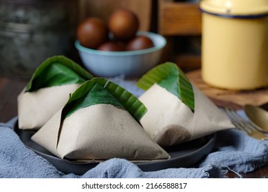 Nasi Lemak, A Malay Style Complete Meal Of Fragrant Rice Cooked In Coconut Milk, Wrapped In Banana Leave.