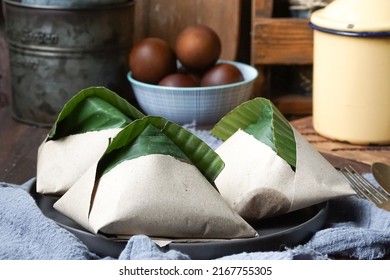 Nasi Lemak, A Malay Style Complete Meal Of Fragrant Rice Cooked In Coconut Milk, Wrapped In Banana Leaf.