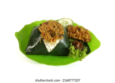 Nasi Liwet Ayam Suwir Or Shredded Chicken Steamed Rice  Food Is Traditional Indonesian Food On Isolated White. The Food Consist Of Chicken, Cucumber,  Lettuce, Fried Tempeh, Terasi Sauce And Rice.