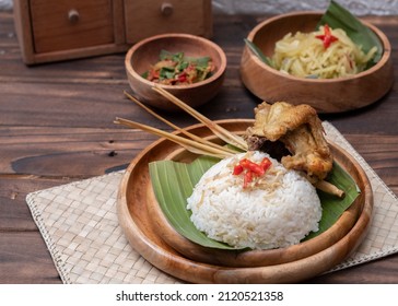 "Nasi Liwet Khas Sunda" one of authentic food and cuisine from Sunda, West Java, Indonesia. Serving with sauté vegetables, chilli sauce and fried chicken. Indonesian food. Selective Focus