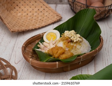 Nasi Liwet Solo, A Traditional Food From Surakarta, Indonesia, Savory Steamed Rice With Pulled Chicken Curry And Chicken Egg