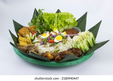 Nasi Liwet Sunda. A Traditional Sundanese Rice Dish Of White Rice Cooked With Spices And Topped With Anchovies, Chili Peppers And Broad Beans