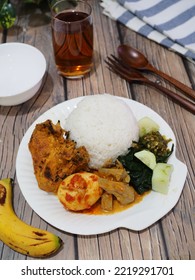 Nasi Padang, More Commonly Referred To As Padang Rice, Is A Minangkabau Steamed Rice Served With Grill Chicken Curry And Spicy Boiled Egg Originating From West Sumatra, Indonesia.