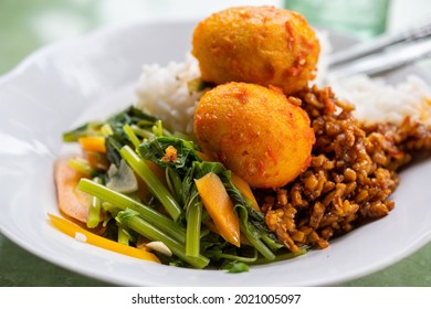 Nasi Rames Warteg, A Traditional Indonesian Food. Rice, Sambal Egg And Vegetables.