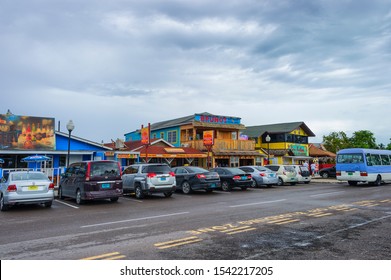 Nassau, Bahama - September 21/2019:  Views Of Arawak Cay Fish Fry Village,of Hand Painted Colorful Structures Providing Caribben Fish Food And Drinks Along The Beach Shore.