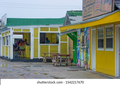 Nassau, Bahama - September 21/2019:  Views Of Arawak Cay Fish Fry Village,of Hand Painted Colorful Structures Providing Caribben Fish Food And Drinks Along The Beach Shore.