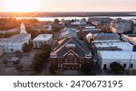 Natchez, Mississippi, USA - April 21, 2024: Sunset bathes historic downtown Natchez in beautiful golden light.