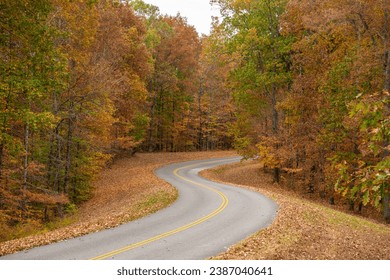 Natchez Trace Parkway road in Tennessee, USA during the fall season. The Natchez Trace Parkway is a national parkway in the Southeastern United States that commemorates the historic Natchez Trace