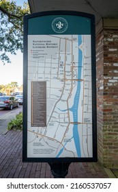 Natchitoches, LA - Oct. 22, 2021: Outdoor sign on Front Street with a map of the National Historic Landmark District.
