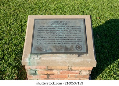 Natchitoches, LA - Oct. 22, 2021: Sign telling the history of the Roque House on the Cane River waterfront, a French Creole building constructed by a freedman of color named Yves.