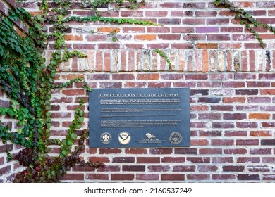 Natchitoches, LA - Oct. 22, 2021: Outdoor Sign On The Red Brick Stairway To The Waterfront Tells Of The Great Red River Flood Of 1945.