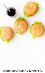 National American Food Concept With Burgers And Coke On White Background Top View Mockup