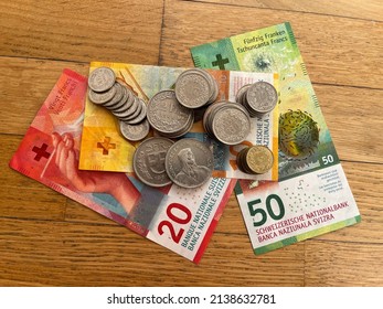 "National bank of Switzerland". Money, currency of Switzerland. Swiss coins and banknotes. CHF franc of different denomination - Shutterstock ID 2138632781