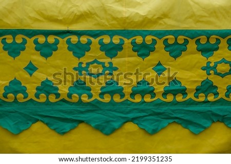 National Bashkir pattern green on yellow fabric