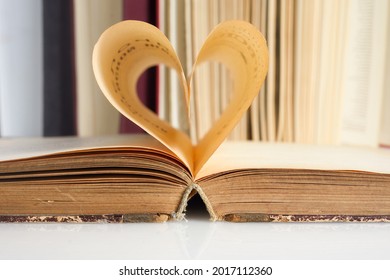 National Book Lovers Day. August 9. The book opens, and the book page rolls into the heart - Powered by Shutterstock