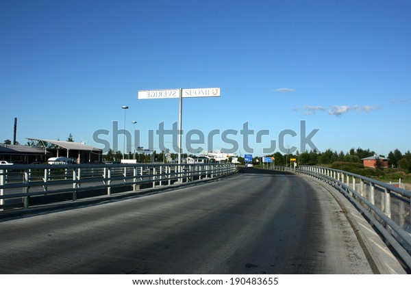 National\
border between Sweden and Finland on the\
road.