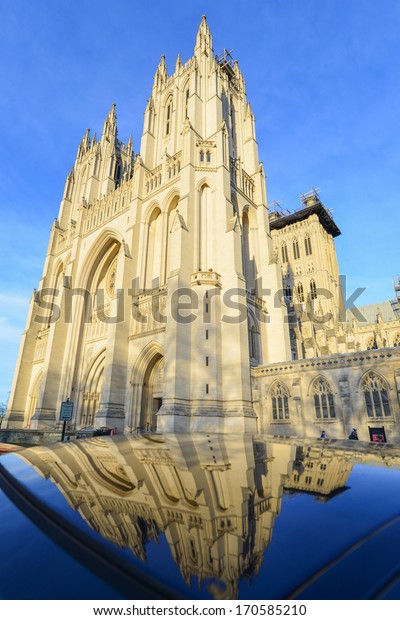 National Cathedral and reflection on a car - Washington\
DC, USA 