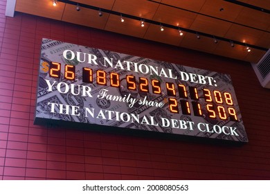 National Debt Clock a billboard sized running total display shows the current United States gross national debt and each American family's share of the debt - New York, USA - June 3, 2021