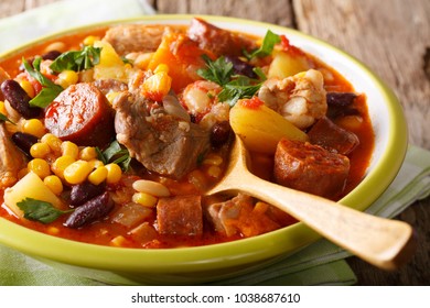 National dish Cape Verde - Cachupa stew with meat and vegetables close-up in a plate. horizontal