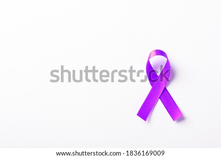 National Epilepsy or Alzheimer disease Day Concept. Purple ribbon symbol of Pancreatic cancer awareness and world Lupus Day and world cancer isolated white background