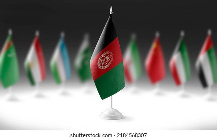 The national flag of the Afghanistan on the background of flags of other countries