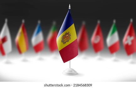 The national flag of the Andorra on the background of flags of other countries