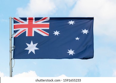 the national flag of Australia on the background of blue sky, the flag of the Australian state on a blue background
