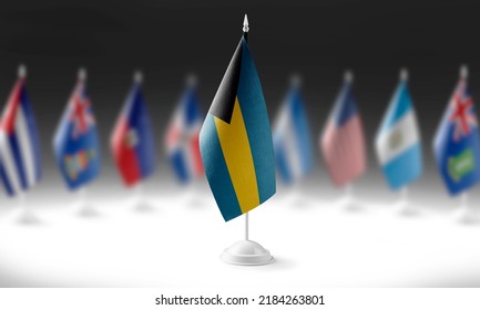 The national flag of the Bahamas on the background of flags of other countries