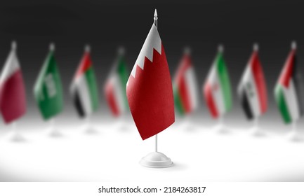 The national flag of the Bahrain on the background of flags of other countries