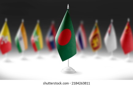 The national flag of the Bangladesh on the background of flags of other countries