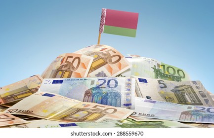 The national flag of Belarus sticking in a pile of mixed european banknotes.(series)