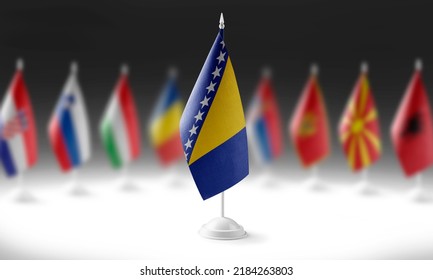 The national flag of the Bosnia and Herzegovina on the background of flags of other countries