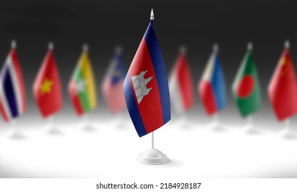 The national flag of the Cambodia on the background of flags of other countries