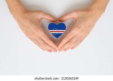 The national flag of Cape Verde in female hands. - Shutterstock ID 2130365249