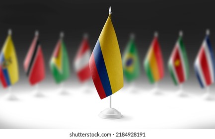 The national flag of the Colombia on the background of flags of other countries