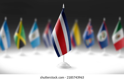 The national flag of the Costa Rica on the background of flags of other countries
