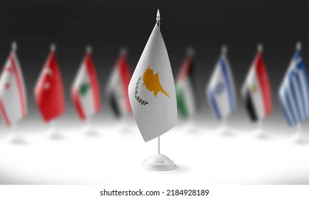 The national flag of the Cyprus on the background of flags of other countries